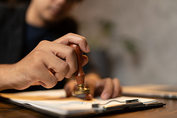 Notary stamping a property deed